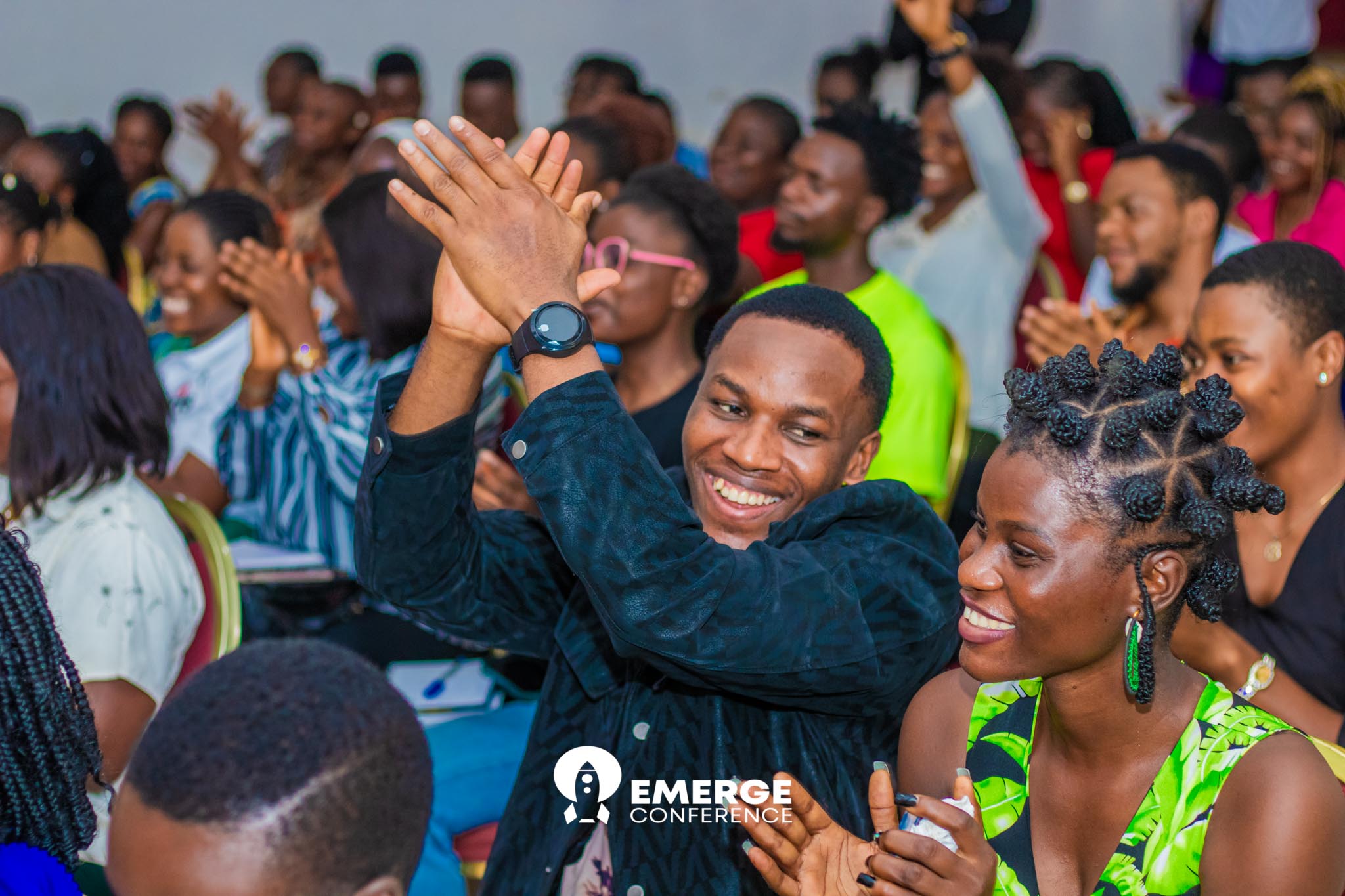 Young leaders applauding at Emerge Conference